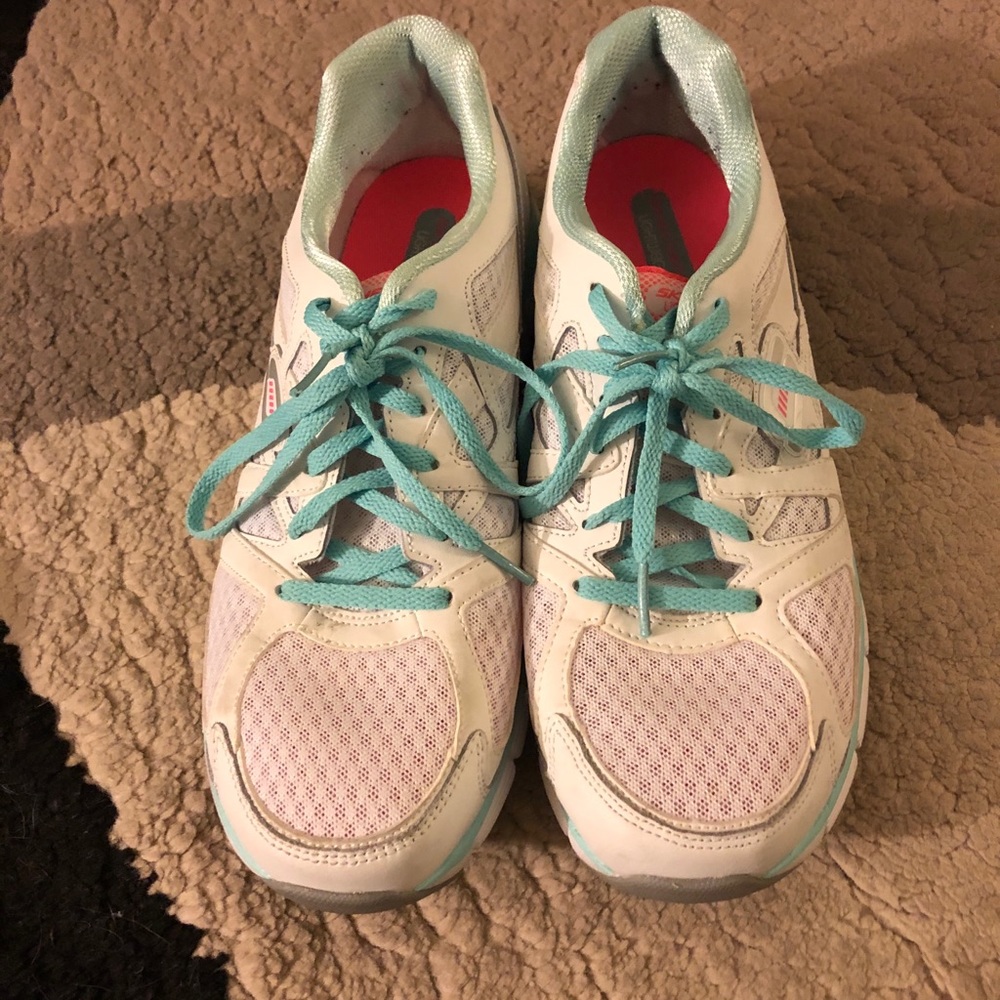 White and green sketchers walking shoes